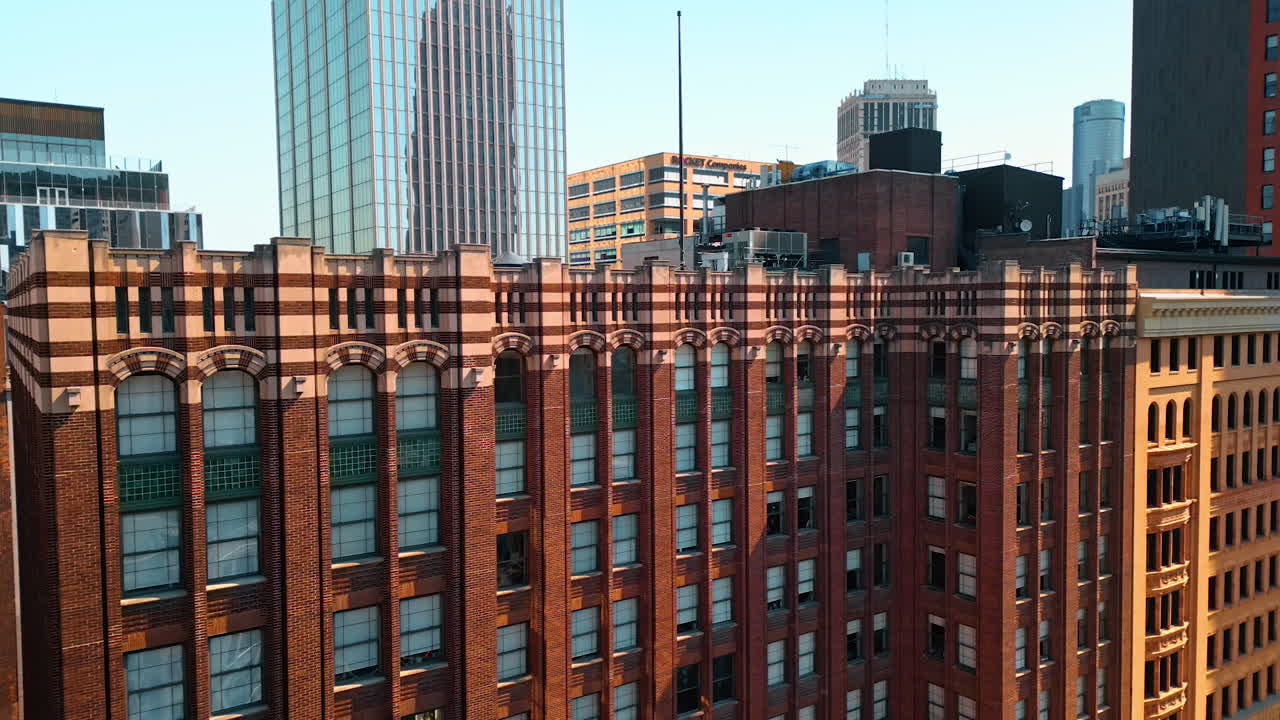 Detroit, USA, 28 July 2025: Rising to the top of a beautiful old-style building of Shinola Headquarters retail company. Architecture of Detroit downtown, Michigan, USA. Drone footage