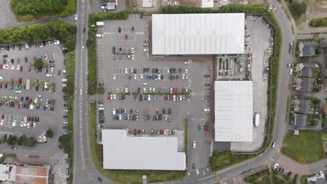 aerial view of a large retail store and parking lot