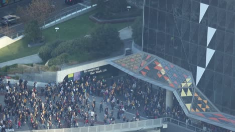 large crowd gathering outside a building