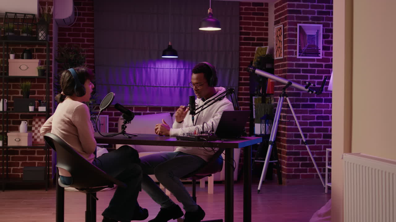 African american podcaster introducing guest to listeners in evening online show broadcast