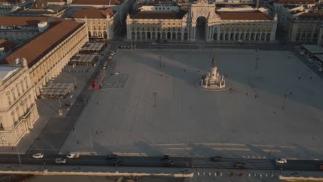 areal drone footage of the historical center praca do comercio town square in lisbon, portugal, filmed during sunset