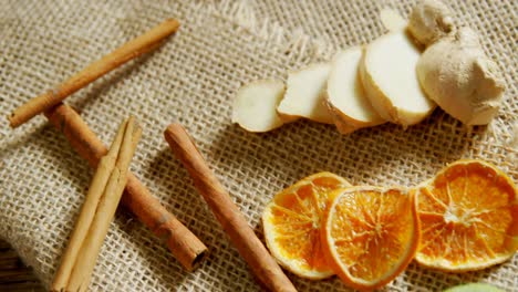 Cinnamon-sticks-with-sliced-ginger-and-lemon-4k