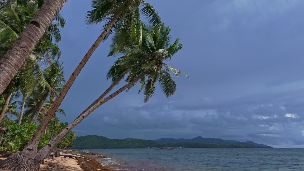 Dark skies over tropical beaches in Dinagat Island Philippines