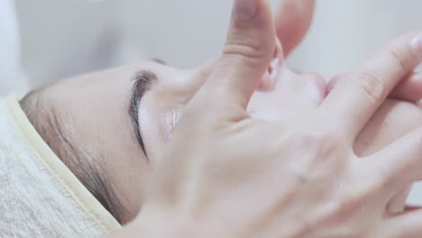 pretty female client lying on the couch in beaty spa-salon