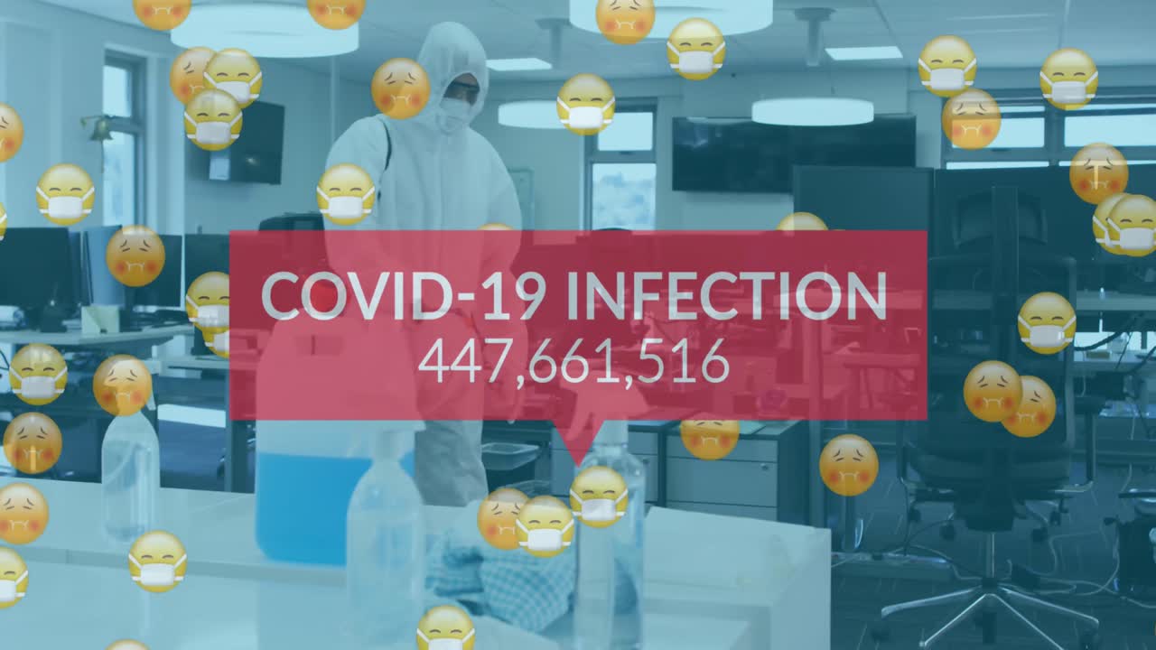 Animation of word covid-19 and emojis floating with man disinfecting the office