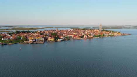 isolated view of burano charming venetian lagoon island during sunset near venice, italy. aerial drone shot
