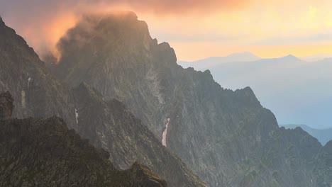 mountain landscape dynamic slow stable drone shot at sunset in alpine environment and sharp ridges in austria