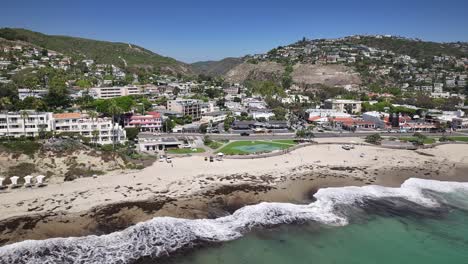 flying over the pacific ocean trucking right looking at main beach in laguna california