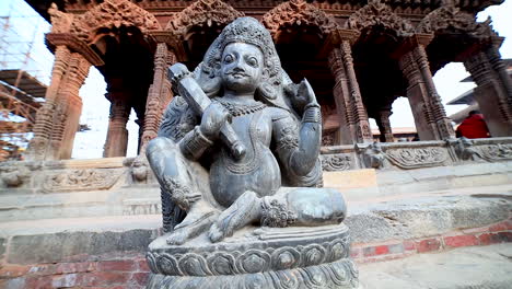 pan statue of hindu goddess carved on a stone at patan durbar square