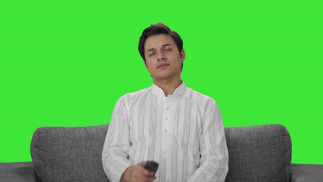 Tired-Indian-man-watching-TV-Green-screen