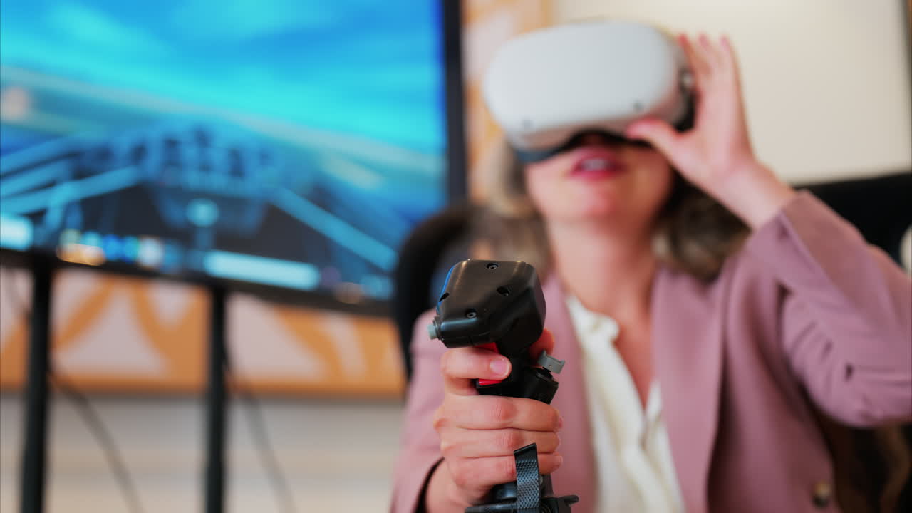 Woman wearing a Virtual Reality headset, playing games, holding a handle