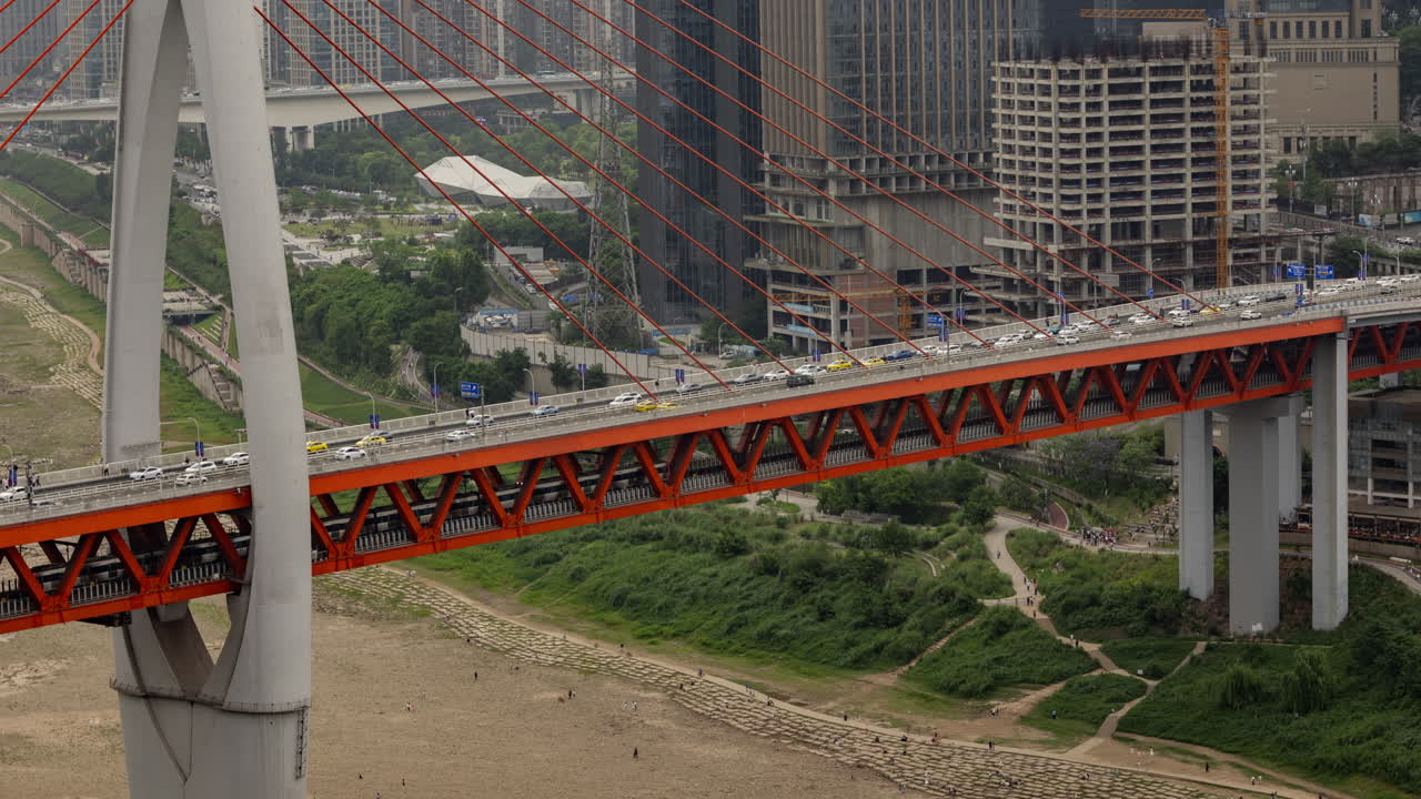 Timelapse of the amazing Chongqing cyberpunk city skyline from a high vantage point wirh the yangtze river at sunset
