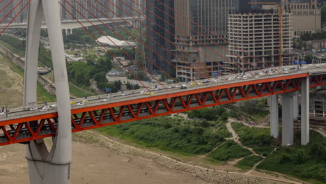 timelapse of the amazing chongqing cyberpunk city skyline from a high vantage point wirh the yangtze river at sunset