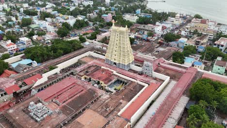 aerial video of iconic ramanathaswamy temple, a magnificent hindu pilgrimage site, with its towering gopurams and serene atmosphere.network of island and causeways that make up the pamban island group