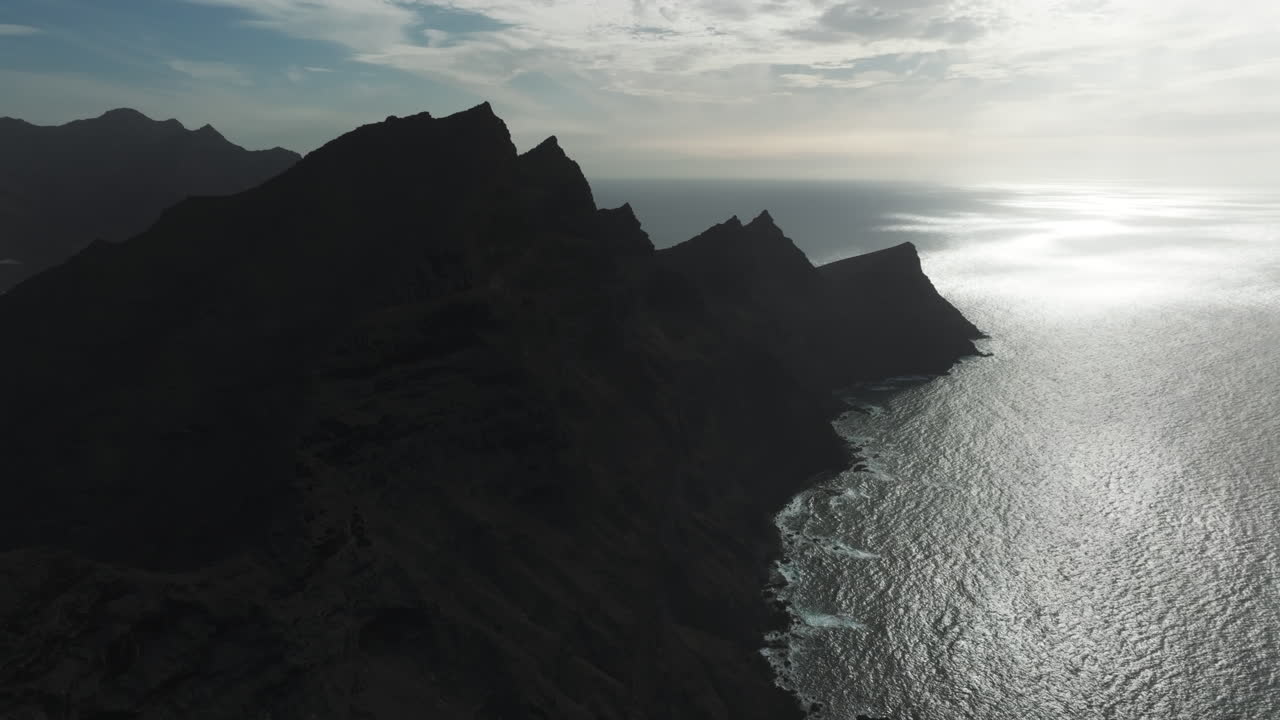 Aerial view of the mountain formations called "Dragon's Tail" in the "Aldea de San Nicolas" during sunset