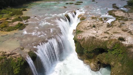 Powerful-waterfall-cascading-over-canyon-Mexico,-aerial-4K-view