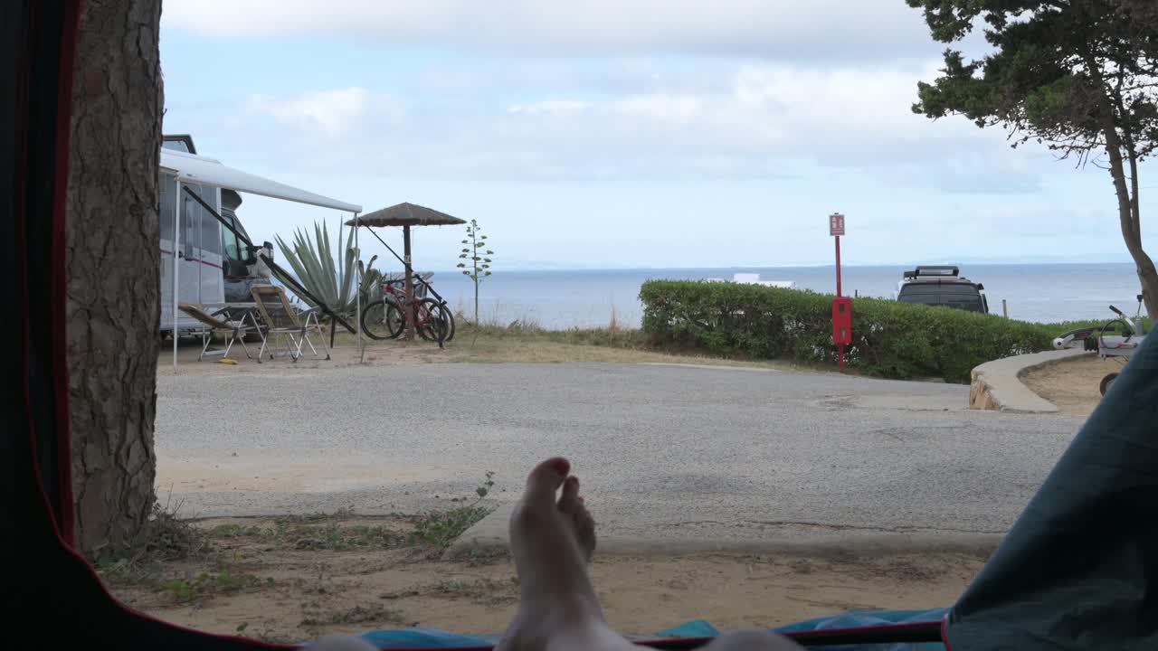 Ocean view from inside a camping tent near the coastline
