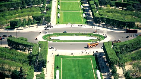 aerial view from eiffel tower of place jacques rueff with tourists, buses and cars - paris, france