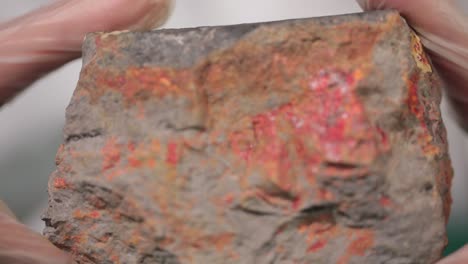 person holding a rock sample