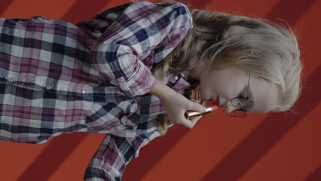 girl applying lipstick