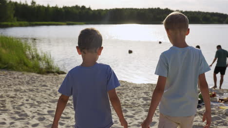 boys playing on the beach