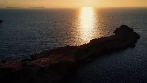 sunset reflection on the sea water surface, idyllic and peaceful atmosphere during dusk time, location captured at ibiza, spain