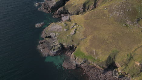 aerial birdseye view of rocky coast of melvaig, scotland