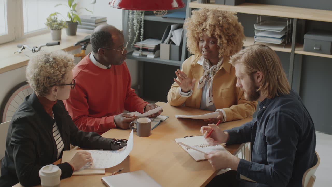 International Business Team Discussing Project at Meeting