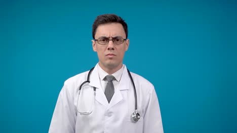 a doctor expressing stress, frustration, and seriousness