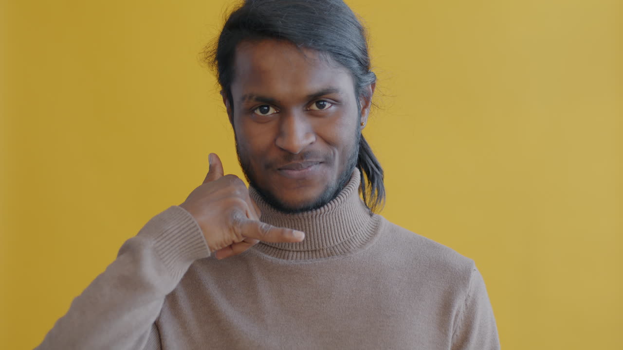 Man making a phone gesture