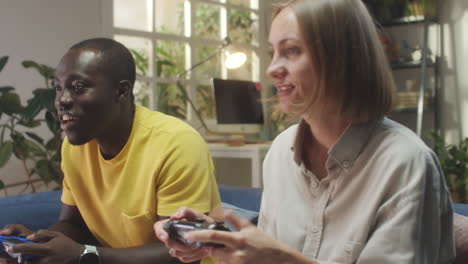 couple playing video games at home