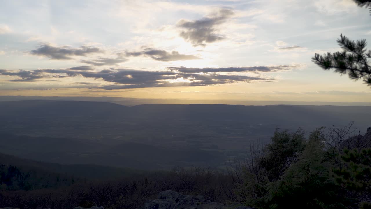 Mountain view of sun setting stock