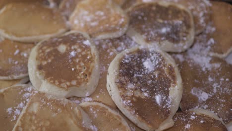 fluffy baked american pancakes covered with powdered sugar