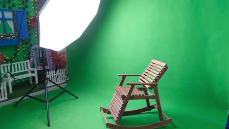 photo or video studio with two hexagone studio lights. green screen and fixed chair