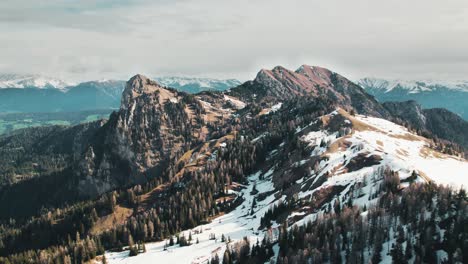 Mountains and hills during springtime partly covered in snow