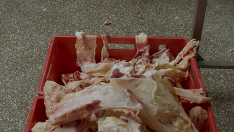 slice of meat being thrown into crate