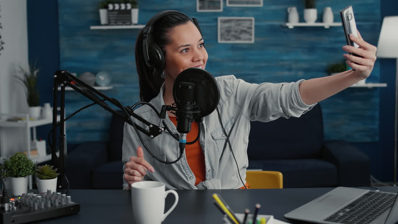 Creative content creator taking selfie photo while recording podcast show