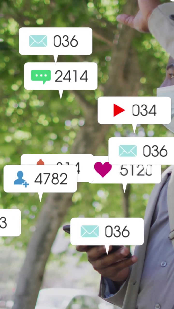 Man in Face Mask Using Smartphone with Social Media Notifications