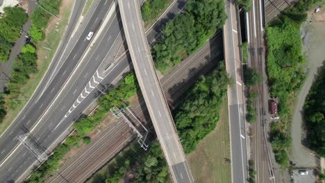 overhead view of crossing highways, bridges and train lines in new jersey, usa