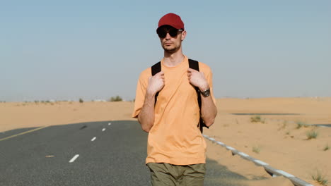 male adventurer crossing the desert