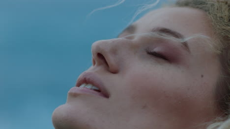 close-up-portrait-of-beautiful-woman-peaceful-contemplating-journey-exploring-spirituality-feeling-freedom-with-wind-blowing-hair