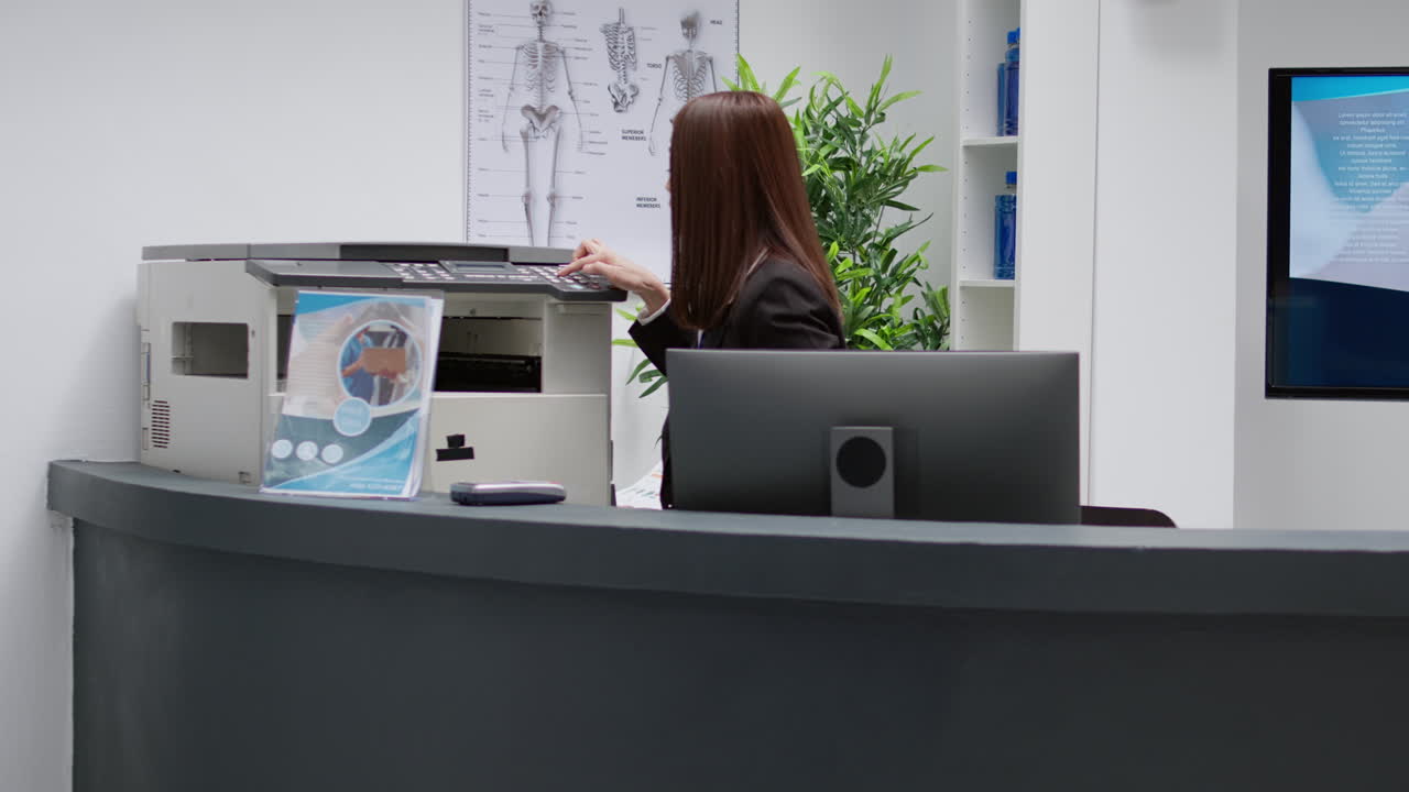 Hospital waiting room with patients and receptionist