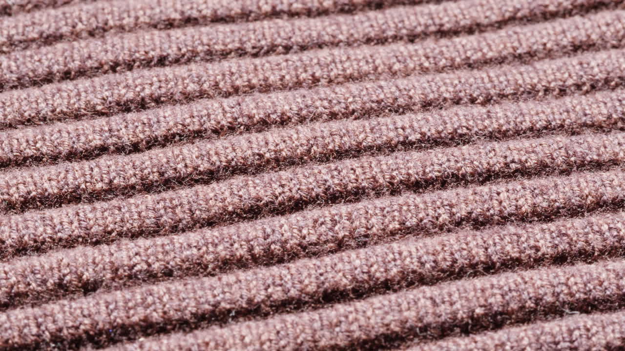 Close-up of brown ribbed knit fabric