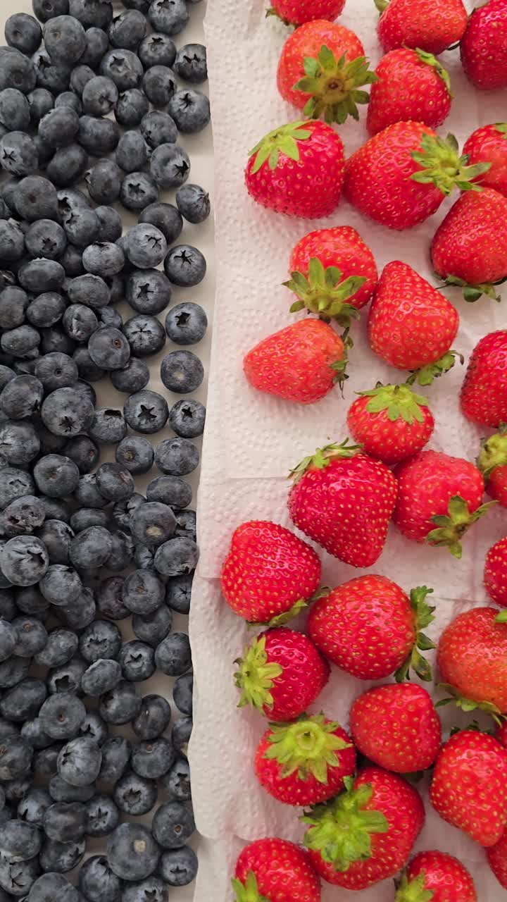 A vibrant collection of berries ready for cake and muffin toppings at a bakery shop.