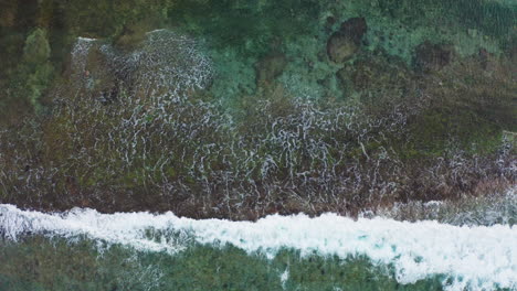 bali indonesia indian ocean long beach waves crushing on rocks