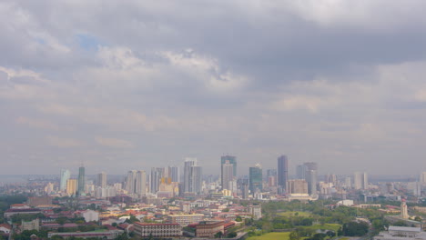 slow motion tilt down shot of clouds to intramuros and binondo city manila