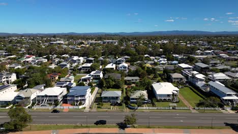 Aerial-view-of-housing-on-the-Sandgate-and-Brighton-waterfront-on-a-sunny-day,-Brisbane,-Queensland,-Australia