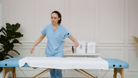 physiotherapist preparing the massage room