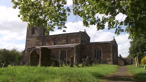 beautiful anglican twelfth century church in the centre of an english rural village in the united kingdom