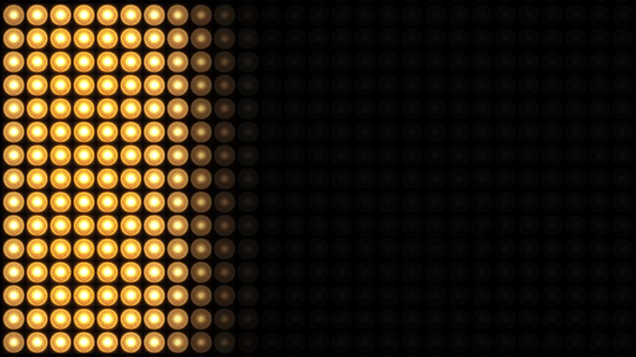 4K loop Animation of flashing light bulbs wall for stage lights Background.